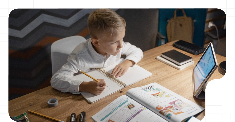 Boy attending to online lesson